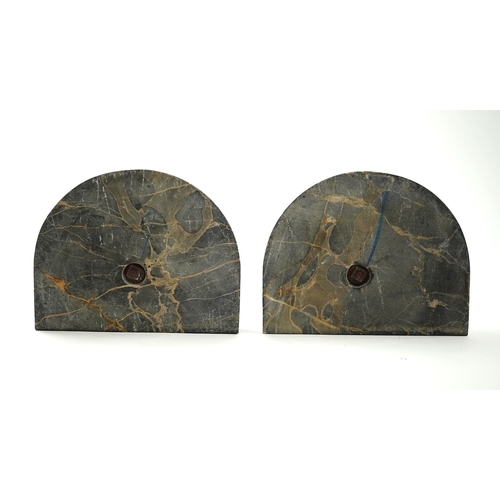 1251 - A pair of bronze peacock bookends, with remains of coloured pigments, marble plinths, signed R. Lecl... 