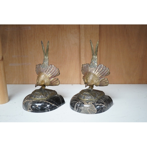 1251 - A pair of bronze peacock bookends, with remains of coloured pigments, marble plinths, signed R. Lecl... 
