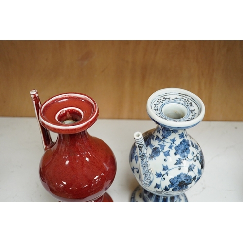 1252 - A Chinese sang de boef ewer, and another in underglaze blue, 22cm high