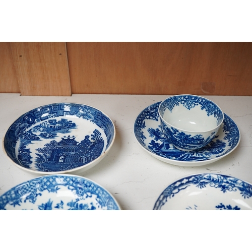 1254 - Two First Period Worcester saucers printed with The Milkmaid pattern in blue, three Worcester saucer... 