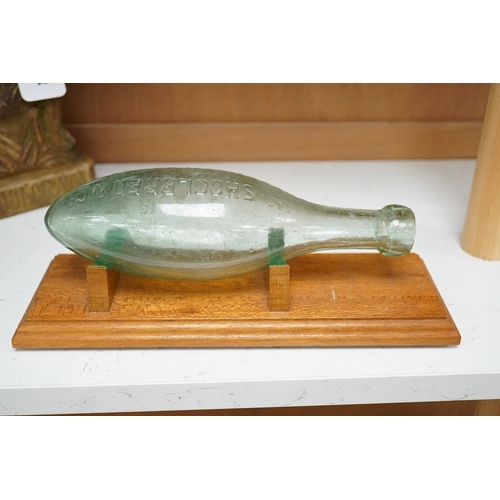 1263 - A Shoolbred & Co pressed glass bottle, on stand, bottle  25cm
