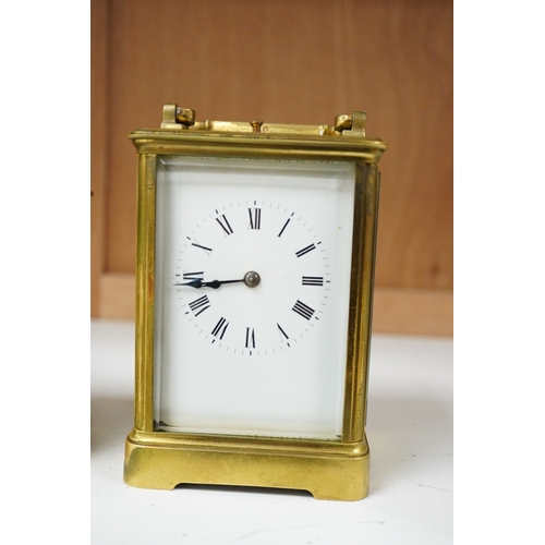 1264 - An early 20th century lacquered brass repeating carriage clock and a smaller carriage timepiece, hei... 