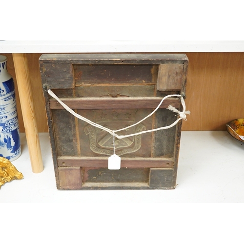 1275 - An heraldic copper panel in grained rosewood frame, panel 22cm x 16.5cm, overall 44.5 x 39.5cm... 