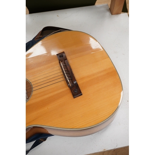 1279 - A Eko P 12 acoustic guitar with carry case