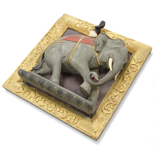 1295 - A giltwood panel with a carved elephant relief, 54cm x 53cm