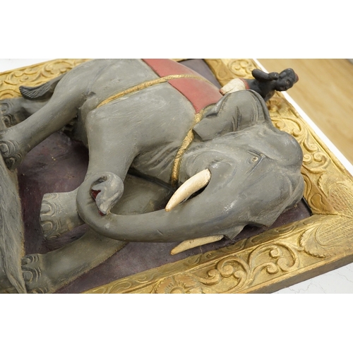 1295 - A giltwood panel with a carved elephant relief, 54cm x 53cm