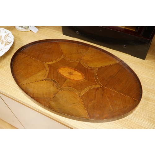 269 - An Edwardian oval patera inlaid mahogany tea tray, 65cm