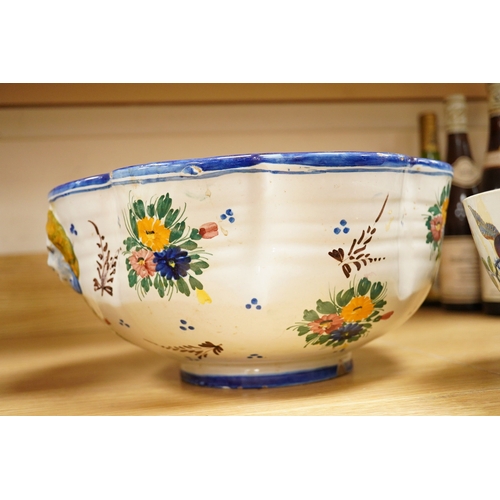 273 - An Italian maiolica punch bowl painted with flowers and masks,  and a Davenport Stone China punch bo... 
