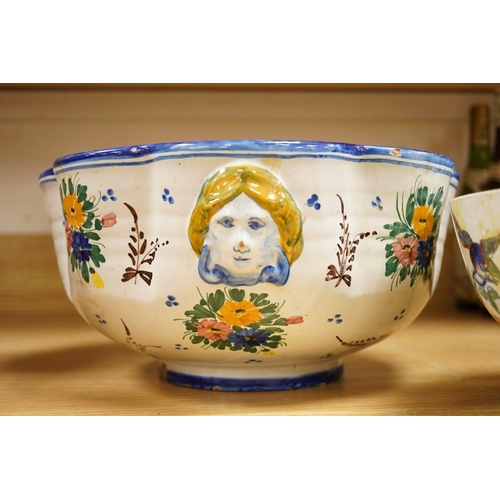 273 - An Italian maiolica punch bowl painted with flowers and masks,  and a Davenport Stone China punch bo... 