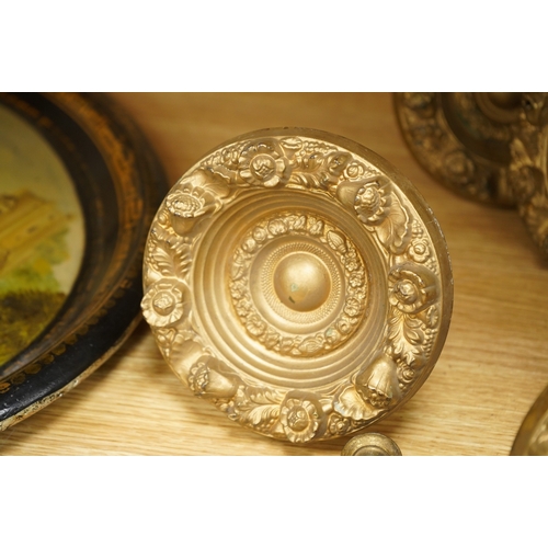 277 - Seven Victorian circular embossed brass curtain tie backs, 17cm diameter