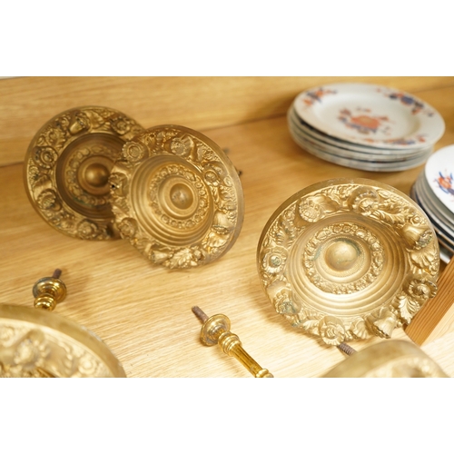277 - Seven Victorian circular embossed brass curtain tie backs, 17cm diameter