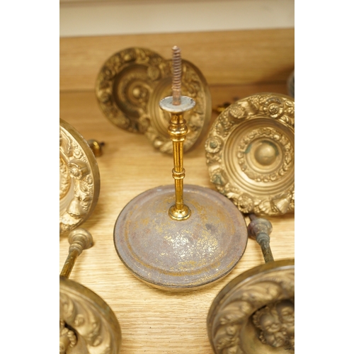 277 - Seven Victorian circular embossed brass curtain tie backs, 17cm diameter