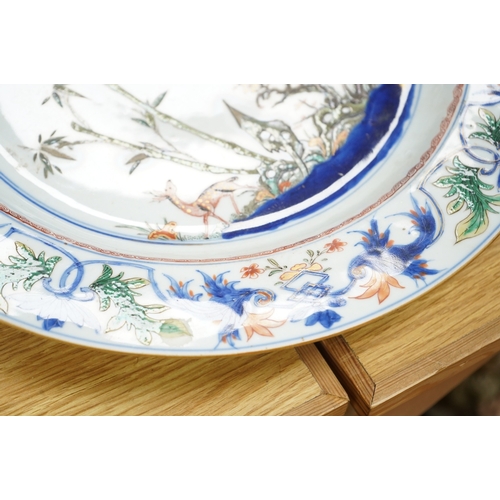 288 - A Chinese famille verte dish, Kangxi period, painted with deer and foliage, 39cm in diameter