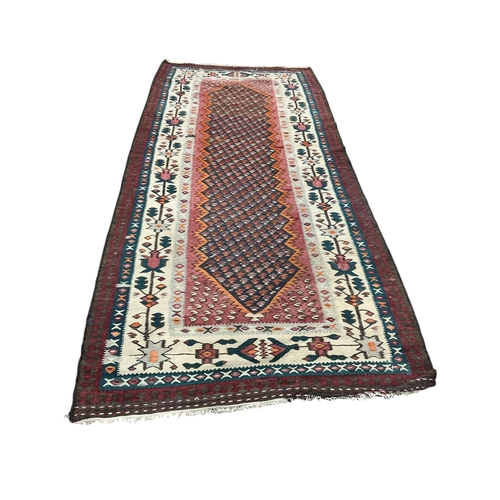36 - A polychrome flatweave kilim, 230 x 135cm