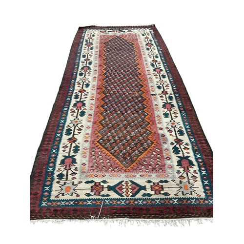 36 - A polychrome flatweave kilim, 230 x 135cm