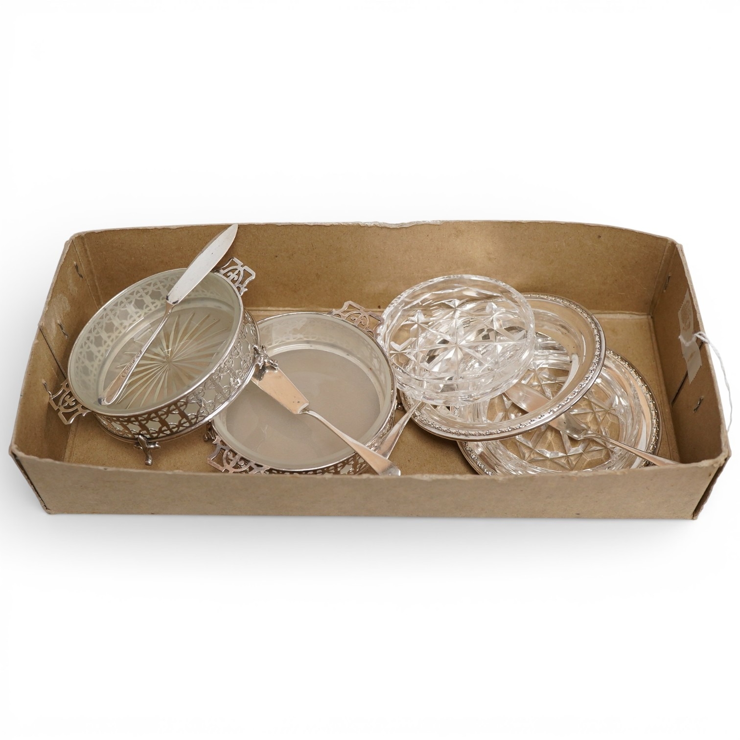 A pair of 1950's silver mounted butter dishes, with glass inserts ...