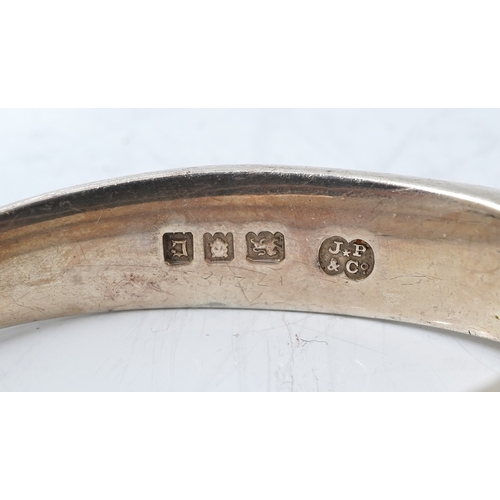 61 - A pair of George V silver nut crackers, by J Parkes & Co, with engraved multi ring decoration, Londo... 
