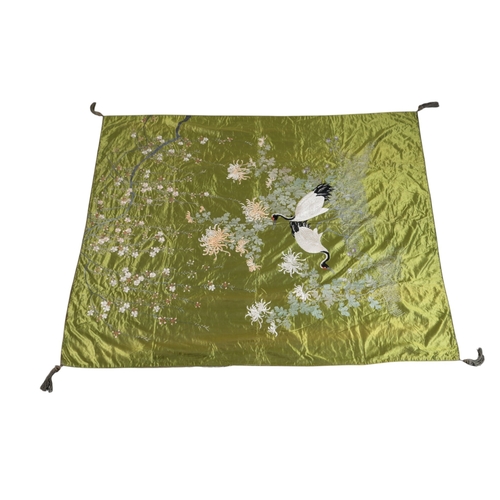 103 - An early to mid 20th century Japanese green silk satin embroidered hanging or fukusa, with two red c... 