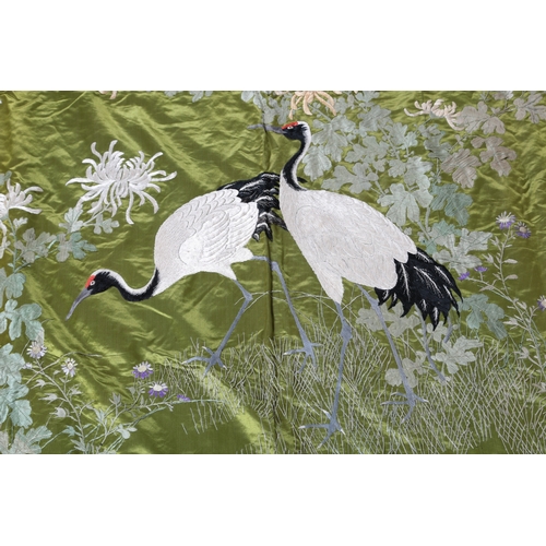 103 - An early to mid 20th century Japanese green silk satin embroidered hanging or fukusa, with two red c... 