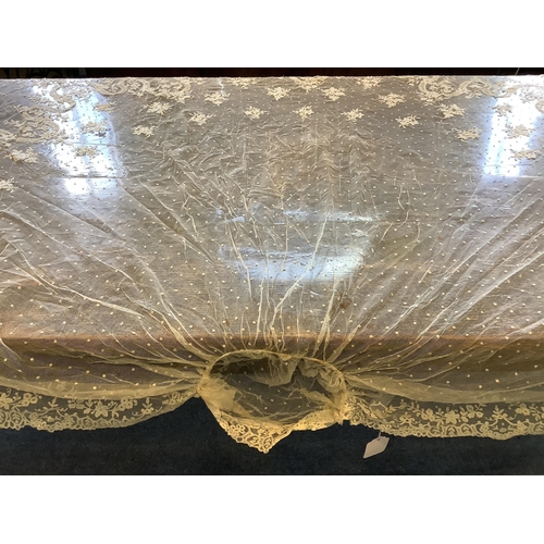 104 - An early 20th century Brussels bobbin lace wedding veil and later Carrickmacross lace stole. The vei... 