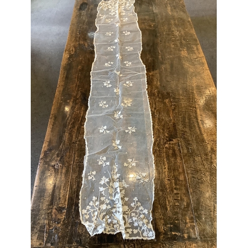 104 - An early 20th century Brussels bobbin lace wedding veil and later Carrickmacross lace stole. The vei... 