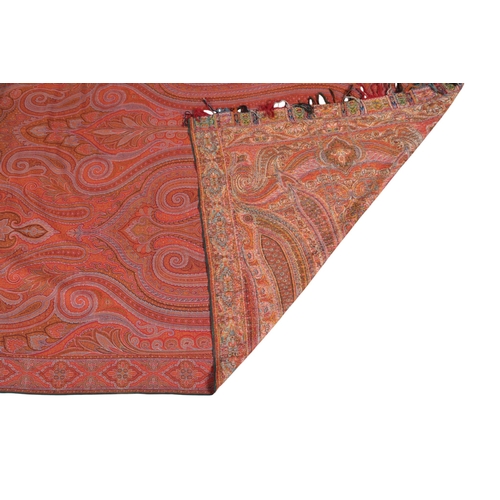 107 - A handsome mid 1800's wool woven Scottish paisley shawl, designed with an ornate large extended tear... 
