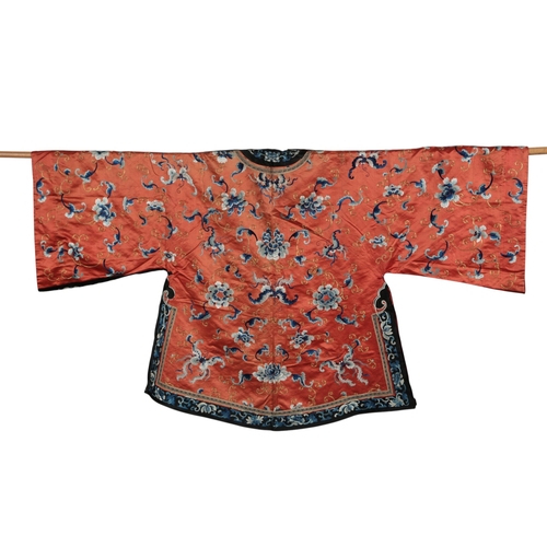 108 - A late 19th century Chinese coral silk robe embroidered with bats and flowers in blues and gold thre... 