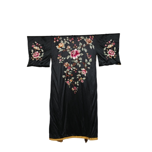 109 - A 1930's-40's Japanese black silk kimono, with multi-coloured floral embroidered front, back and sle... 