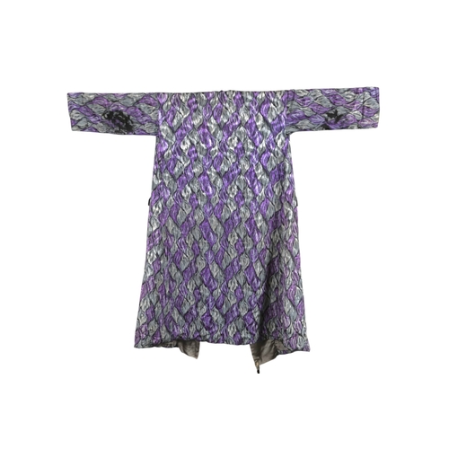 113 - An early 20th century large gentleman's dressing gown, made from purple and grey printed silk, with ... 