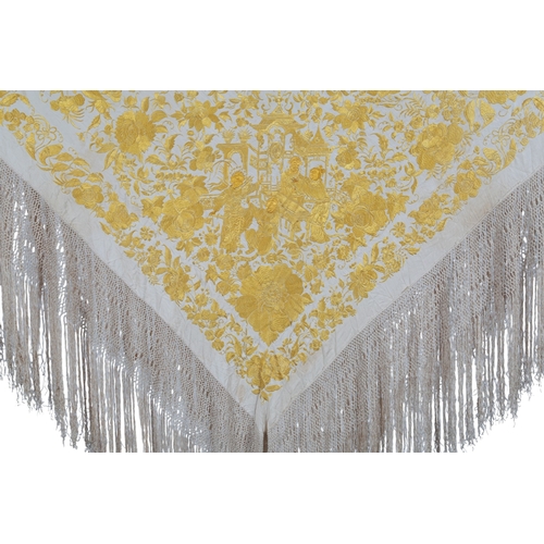 114 - A large Chinese 19th century gold silk embroidered cream shawl, two corners embroidered with large p... 