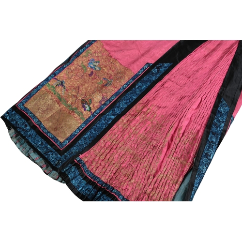 115 - A 19th century Chinese ladies pink silk damask embroidered wedding skirt, the front panels embroider... 