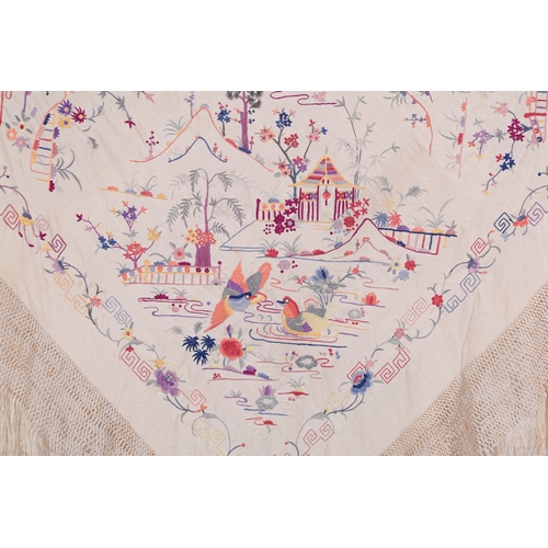 116 - A Chinese early 20th century cream silk, polychrome embroidered shawl. Embroidered with cherry bloss... 