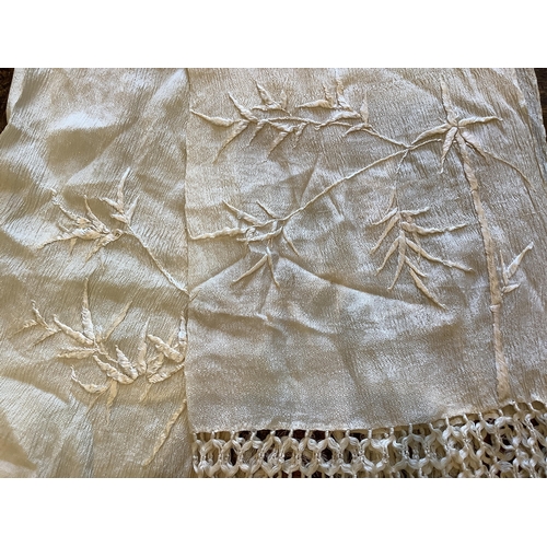 117 - An early 20th century Chinese cream on cream silk embroidered panel, 150cm x 154cm and a silk chiffo... 