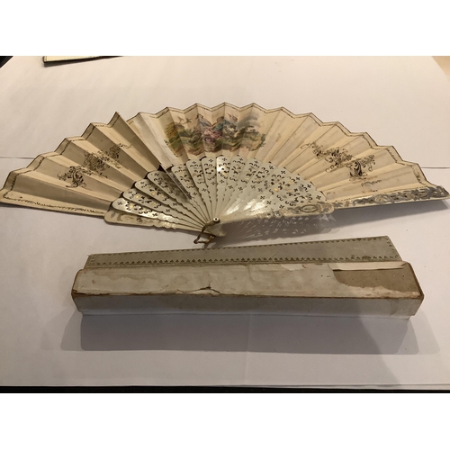 63 - A 19th century Spanish parchment and abalone fan the leaf painted with a figurative interior scene, ... 