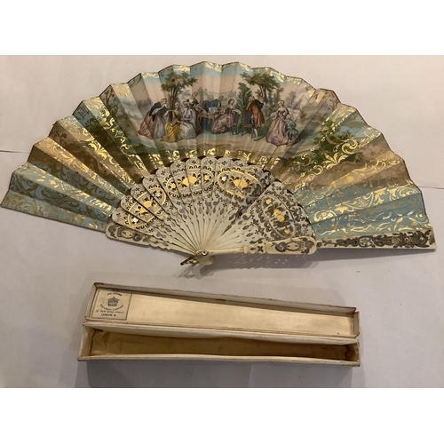 63 - A 19th century Spanish parchment and abalone fan the leaf painted with a figurative interior scene, ... 