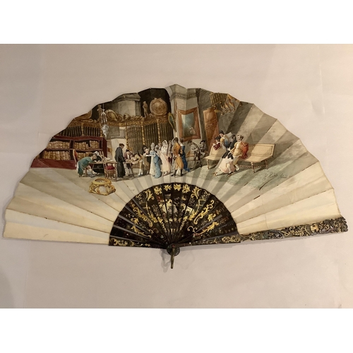 63 - A 19th century Spanish parchment and abalone fan the leaf painted with a figurative interior scene, ... 