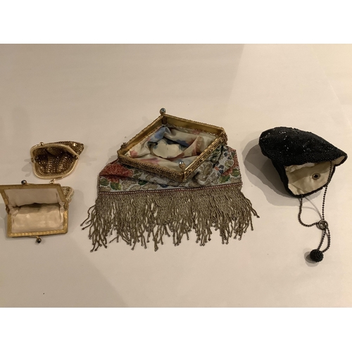 64 - A late 19th century micro steel beaded evening bag and three purses, the bag with beaded fringe, gil... 