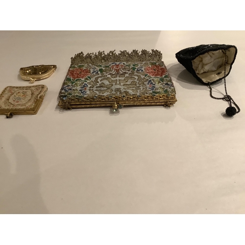 64 - A late 19th century micro steel beaded evening bag and three purses, the bag with beaded fringe, gil... 