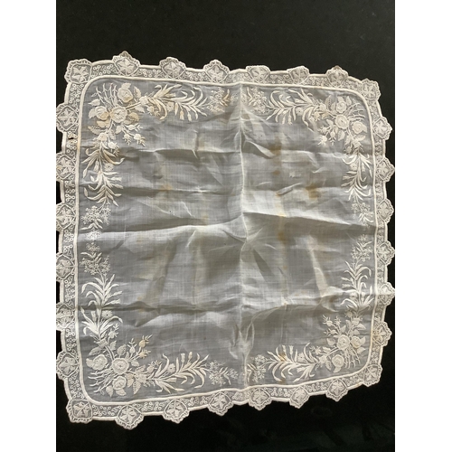 65 - A 19th century fine lawn white worked ladies wedding hankie 40cm x 41cm with an ornately deep white ... 