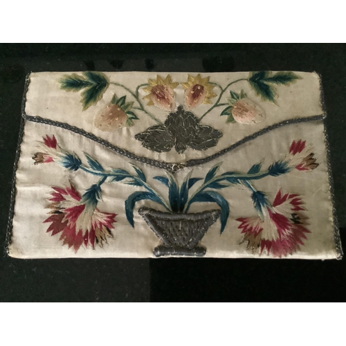 70 - A rare late 17th century cream silk purse, possibly a bible bag, the front finely embroidered in pol... 