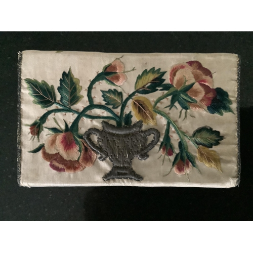 70 - A rare late 17th century cream silk purse, possibly a bible bag, the front finely embroidered in pol... 