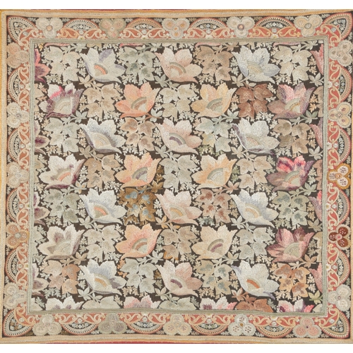 72 - A framed late 19th century silk floral embroidery on brown and red woven background, embroidered wit... 