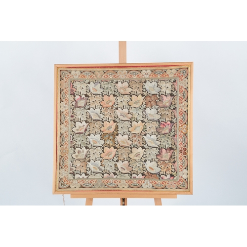 72 - A framed late 19th century silk floral embroidery on brown and red woven background, embroidered wit... 