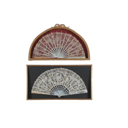 76 - Two 19th century mother of pearl Brussels lace fans framed and glazed. One with a central Point de G... 