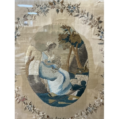 82 - Two George III framed silk female figural pastoral embroideries. One embroidered with a seated lady ... 