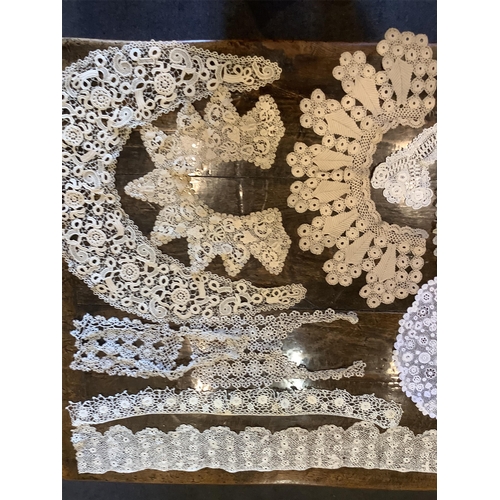 93 - A collection ten various sized Irish crochet collars- largest 94cm long, together with silk Maltese ... 