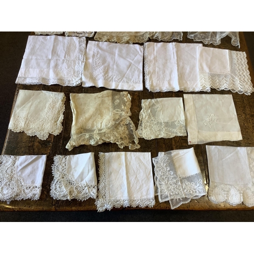 95 - Good for bridal, tv and film designers; a collection of mixed hand lace edged and white worked hanki... 