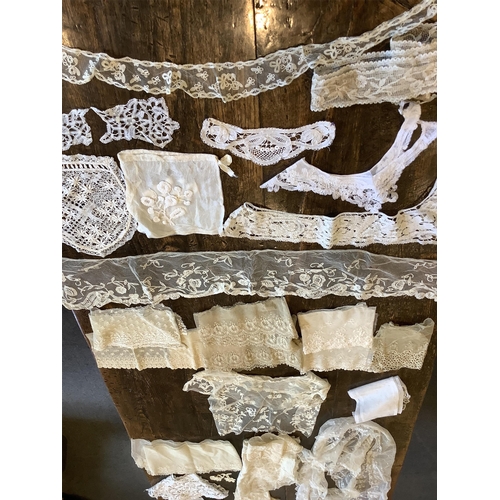 95 - Good for bridal, tv and film designers; a collection of mixed hand lace edged and white worked hanki... 