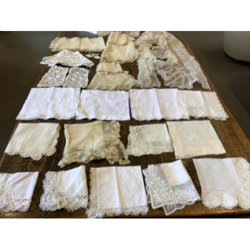 95 - Good for bridal, tv and film designers; a collection of mixed hand lace edged and white worked hanki... 