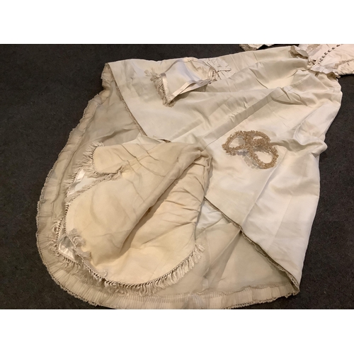 96 - A rare 1860s cream silk grosgrain wedding dress, with bustle apron, a bow attachment and floral waxe... 